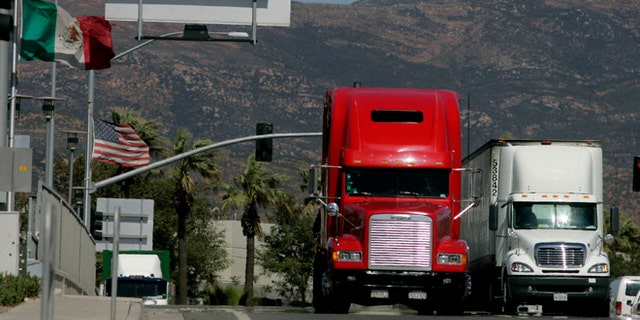 OTAY MESA, CA-MARCH 24: Trucks coming from Mexico prepare to enter the highway after crossing the border March 24, 2009 in Otay Mesa, California. Mexico last week slapped higher tariffs on an estimated $2.4 billion worth of goods entering the country from the U.S. in response to a move by Congress to end a pilot program allowing Mexican trucks to operate in the U.S. (Photo by Sandy Huffaker/Getty Images)