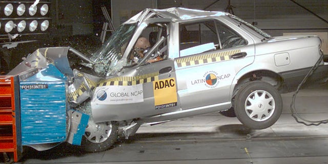 In this image taken from a March 2013 video released by independent crash-test group Latin NCAP on Nov. 27, 2013, a Nissan model Tsuru vehicle with no airbags is crash-tested at Latin NCAP's facilities in Landsberg am Lech, Germany.VMany international car manufacturers with plants in Mexico produce two versions of cars; sending models with air bags, antilock brakes and electronic stability control to the United States, and cars without those safety features to the local market. (AP Photo/Latin NCAP)