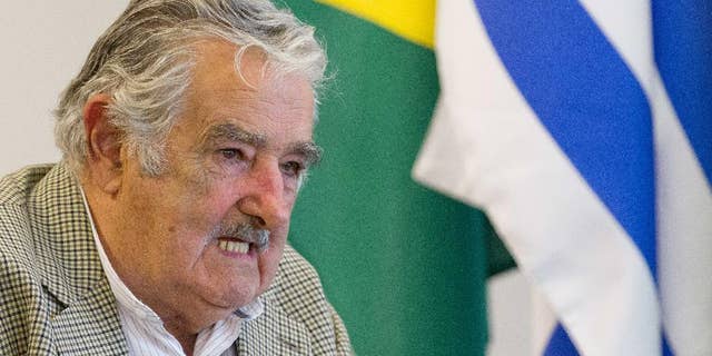 FILE - In this Nov. 7, 2014, file photo, Uruguay's President Jose Mujica meets with Brazil’s President Dilma Rousseff at the Planalto presidential palace, in Brasilia, Brazil. The Mexican foreign office has called in Uruguay’s ambassador on Nov. 23, to ask for an explanation about the words of Uruguayan President Mujica when he said in an interview that Mexico is beginning to feel like a failed state. (AP Photo/Eraldo Peres, File)