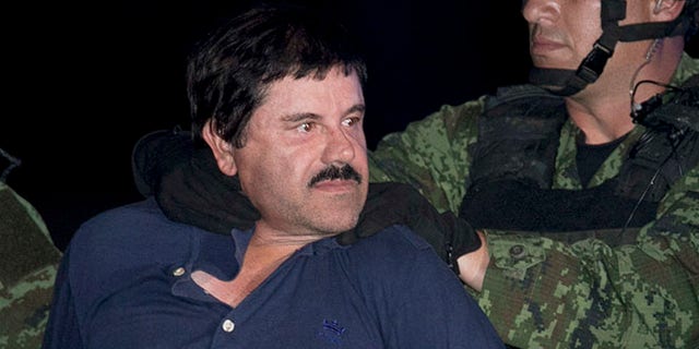 FILE - In this Jan. 8, 2016, file photo, Mexican drug lord Joaquin "El Chapo" Guzman is made to face the press as he is escorted to a helicopter in handcuffs by Mexican soldiers and marines at a federal hangar in Mexico City, Mexico. The son of the imprisoned drug lord may be among the half-dozen men abducted by gunmen at a restaurant in the Mexican beach resort of Puerto Vallarta, authorities said Tuesday, Aug 16, 2016. (AP Photo/Marco Ugarte, File)