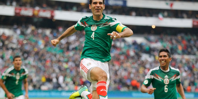 Mexico's Rafael Marquez celebrates after scoring his team's 5th goal during a 2014 World Cup playoff first round match against New Zealand in Mexico City, Wednesday, Nov. 13, 2013. (AP Photo/Eduardo Verdugo)