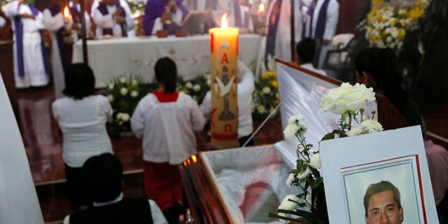 This Sept. 21, 2016 photo shows the funeral Mass for slain Rev. Jose Alfredo Suarez de la Cruz at Our Lady of Asuncion Church in Paso Blanco, Veracruz state, Mexico, his hometown. Church leaders are increasingly frustrated by authoritiesââ¬â¢ inability to protect their priests under Mexican President Enrique Pena Nietoââ¬â¢s administration. (AP Photo/Marco Ugarte)