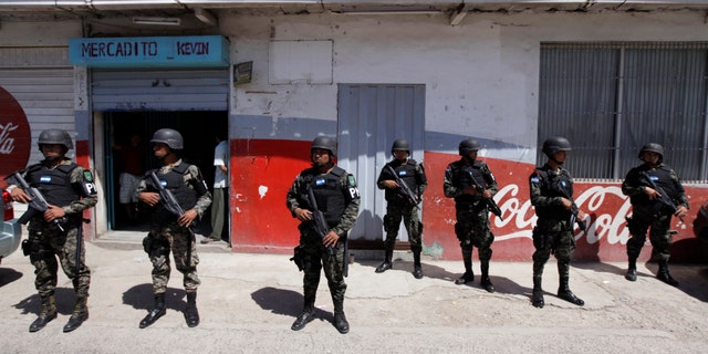 Troops are seen attempting to control the violence aggravated by Mexican drug cartels, which has caused thousands of Mexican citizens to seek asylum in the United States. (REUTERS/Jorge Cabrera)