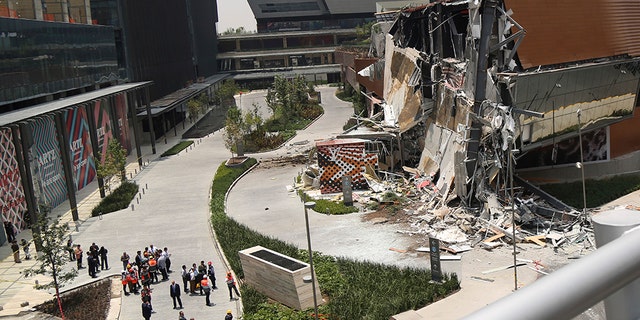The Artz Pedregal shopping mall stands partially collapsed on the south side of Mexico City, Thursday, July 12, 2018. The newly opened shopping mall partly collapsed after structural problems apparently led the mall’s operators to evacuate the area, and no injuries were reported.