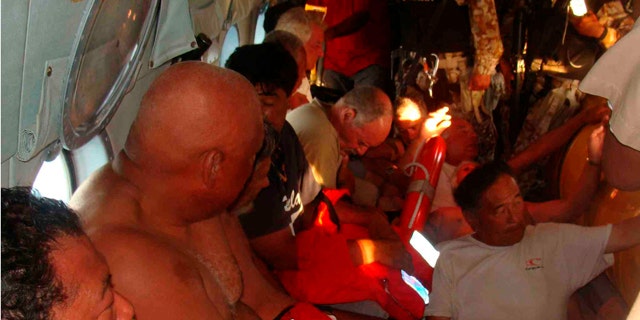 July 4: Survivors of a capsized boat inside a helicopter after being rescued by the Navy in the town of San Felipe.