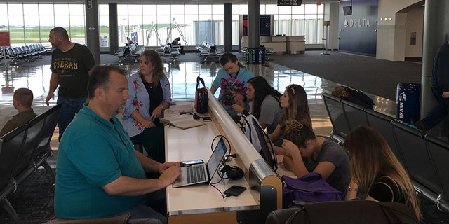 Youth pastor William Davis blames American Airlines for the delay.