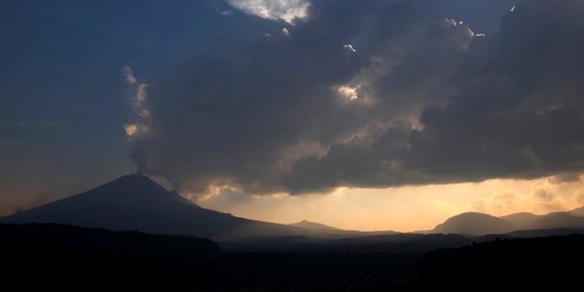 May 12, 2013: The Popocatepetl volcano spews ash and steam as seen from Santiago Xalitzintla, Mexico.
