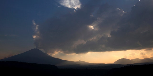 May 12, 2013: The Popocatepetl volcano spews ash and steam as seen from Santiago Xalitzintla, Mexico.