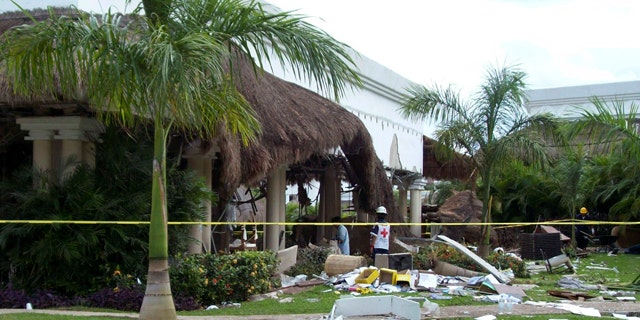 Nov. 14, 2010: Red Cross volunteer watches to the inside of the Grand Riviera Princess Hotel in Playa del Carmen, Quintana Roo state, Mexico.