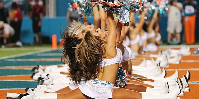 MIAMI GARDENS, FL - DECEMBER 14: Miami Dolphins cheerleaders perform during the second half of the game against the New York Giants at Sun Life Stadium on December 14, 2015 in Miami Gardens, Florida. (Photo by Mike Ehrmann/Getty Images)