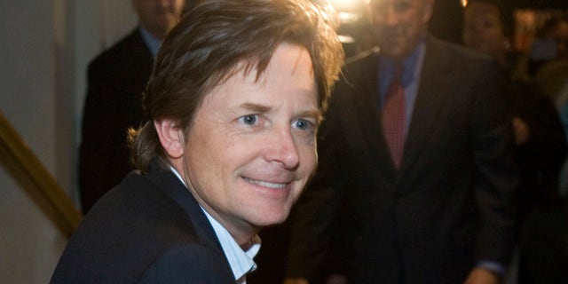 File -- In a Nov. 6, 2006 file photo actor Michael J. Fox greets supporters at a rally for Wisconsin Gov. Jim Doyle in Milwaukee. On his upcoming NBC comedy, Fox will play a newscaster who quits his job because of Parkinson's Disease but returns to work in the show's first episode because a new medical regimen has helped him control many of the disease's symptoms. NBC said Sunday, Jan. 6, 2013, his comedy closely tracks many aspects of Fox's personal life and tries to have fun with an image that has left him an object of pity-fueled admiration.(AP Photo/Morry Gash, File)