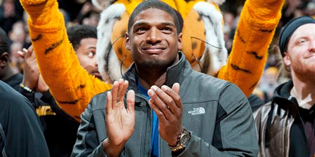 Michael Sam at halftime of an NCAA college basketball game on Feb. 15, 2014.