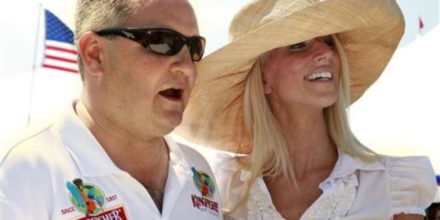 Tareq Salahi, left, and Michaele Salahi host the America's Polo Cup Championships by the National Mall in Washington, on Saturday, June 12, 2010. (AP Photo/Jacquelyn Martin)