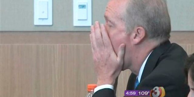 June 29, 2012: In this image taken from video provided by KTVK, 53-year-old Michael Marin puts his hands to his face after he was found guilty of deliberately burning down his $3.5 mansion at the Maricopa County Superior Court in Phoenix.