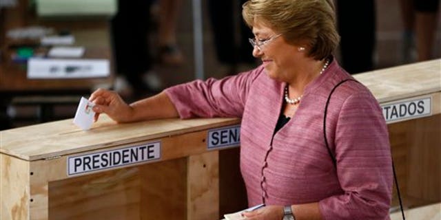 Presidential candidate Michelle Bachelet votes during the general elections in Santiago, Chile. (AP Photo/Victor R. Caivano)