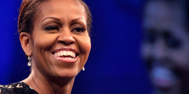 First lady Michelle Obama speaks about childhood obesity at the annual meeting of the National Council of La Raza, in New Orleans, Tuesday, July 23, 2013. The conference and a related "Family Expo" were expected to draw an estimated 25,000 participants. (AP Photo/Gerald Herbert)