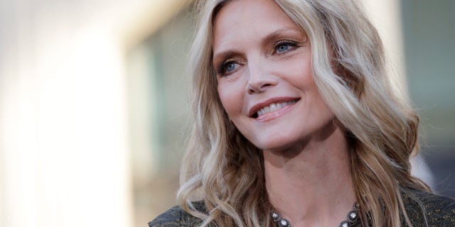 Cast member Michelle Pfeiffer poses at the premiere of the film "Dark Shadows" at the Grauman's Chinese theatre in Hollywood, California May 7, 2012.