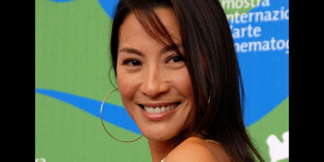 **FILE**Actress Michelle Yeoh poses during the photo call for the movie " Far North" at the 64th edition of the Venice Film Festival in Venice, Italy, Thursday, Aug. 30, 2007. Yeoh will be awarded France's Legion of Honor in an Oct. 3 ceremony in the Malaysian capital of Kuala Lumpur, French Foreign Ministry officials said Tuesday, Sept. 11, 2007.(AP Photo/Luigi Costantini)