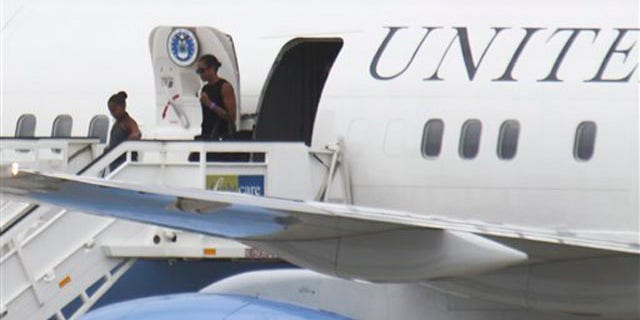 Aug. 4, 2010: U.S. First Lady Michelle Obama and her daughter Sasha went to Spain together last year for a trip with longtime family friends.