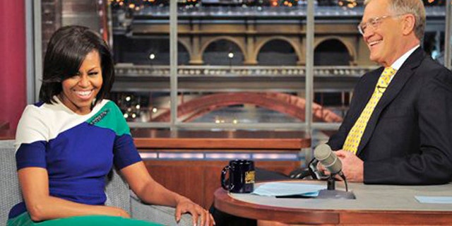 Mar. 19, 2012: In this photo provided by CBS, first lady Michelle Obama joins host David Letterman on the set of the Late Show with David Letterman.