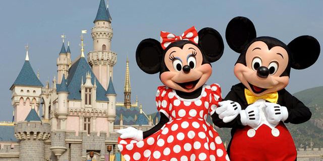 In this photo released by Hong Kong Disneyland, Disney characters Mickey Mouse and Minnie Mouse pose in front of the Sleeping Beauty Castle in Hong Kong's Disneyland Park Thursday, Sept. 1, 2005. Hong Kong Disneyland is due to open Sept. 12. Intellectuals decried the invasion of American pop culture when the last Disneyland opened in Paris in 1992, but Hong Kong has rolled out the red carpet for Mickey Mouse and Donald Duck. ( AP Photo/Disneyland, Mark Ashman)