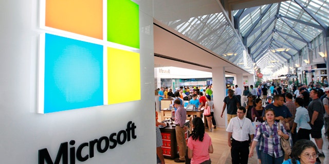 The Microsoft logo is seen on an exterior wall of a Microsoft store inside the Prudential Center mall in Boston. Microsoft will use its annual developers conference to release a preview of Windows 8.1 beginning June 26.