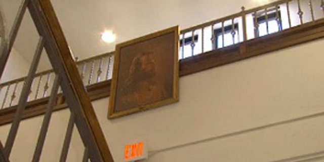 Feb. 7, 2013: Photo of a portrait of Jesus hangs in the hallway at Jackson Middle School in Jackson, Ohio.