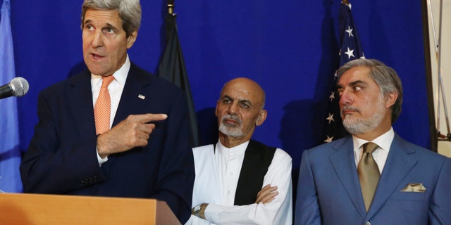 Aug. 8, 2014 - FILE photo of Secretary of State John Kerry, left, speaking as Afghan presidential candidates Ashraf Ghani Ahmadzai, center, and Abdullah Abdullah listen during a press conference in Kabul, Afghanistan. Abdullah said Monday he will not accept the expected outcome of the election's 2nd round and talks with Ahmadzai to form a national unity government are deadlocked.