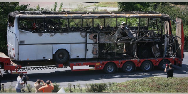July 19, 2012 in this file photo, a damaged bus is transported out of Burgas airport, Bulgaria, a day after a deadly suicide attack on a bus full of Israeli vacationers.