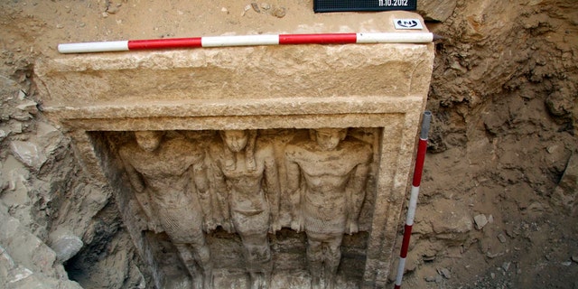 Oct. 11, 2012: This photo released Friday, Nov. 2, 2012 by Egypt's Supreme Council of Antiquities, shows recently discovered statues of two men and a woman in a complex of tombs, including one of a pharaonic princess, in the Abusir region, south of Cairo, Egypt.