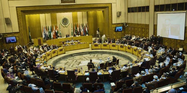 Arab foreign ministers take their seats for their meeting at the Arab League headquarters in Cairo, Egypt, Sunday, Sept. 7, 2014. Abbas, who has threatened to dissolve a new unity government if the Hamas militant group does not yield power in the Gaza Strip, attended the meeting in Cairo on Sunday. (AP Photo/Hassan Ammar)