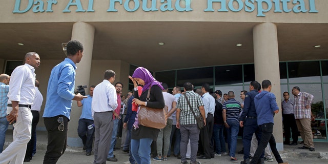 Sept. 14, 2015: Egyptian journalists wait for information about tourists who were injured Sunday while on a desert safari trip.
