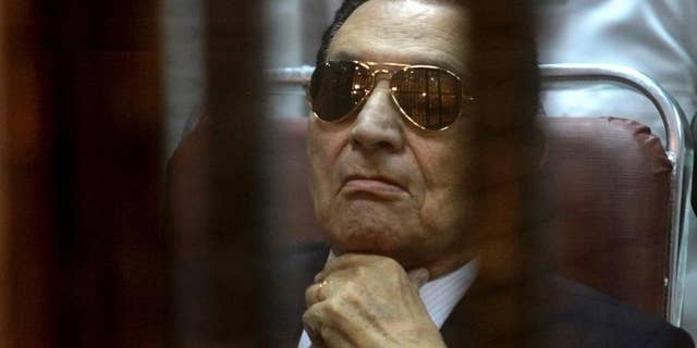 April 26, 2014: In this file photo, ousted Egyptian President Hosni Mubarak attends a hearing in his retrial over charges of failing to stop killings of protesters during the 2011 uprising that led to his downfall, in the Police Academy-turned-court in the outskirts of Cairo, Egypt. (AP)
