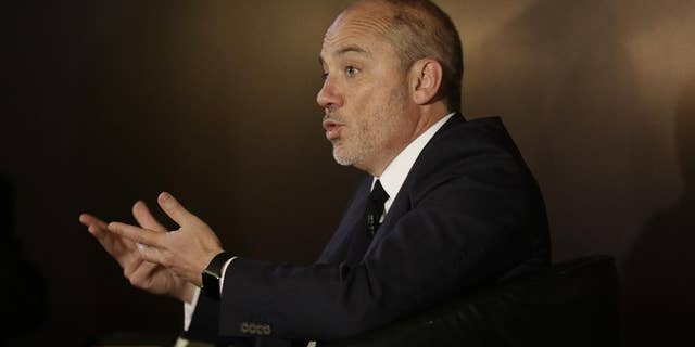 FILE - In this Wednesday, June 3, 2015 file photo, Stephane Richard, the chief executive officer of French mobile phone company Orange, gestures as he speaks during a press conference in Cairo, Egypt. Richard apologized to Israel's prime minister on Friday, June 12, 2015 for his recent comments on pulling out of Israel, saying he opposes the boycott movement against the Jewish state and will continue to invest in it. (AP Photo/Thomas Hartwell, File)