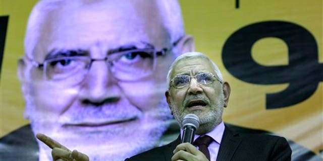 March 9: Egyptian presidential hopeful Abdel-Moneim Abolfotoh, a Muslim Brotherhood figure, talks under a giant billboard showing his picture during a conference in Cairo, Egypt.