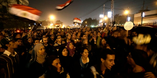 Dec. 6, 2012 - Egyptian protesters chant anti Muslim Brotherhood and Egyptian President Morsi slogans outside the presidential palace in Cairo, Egypt.