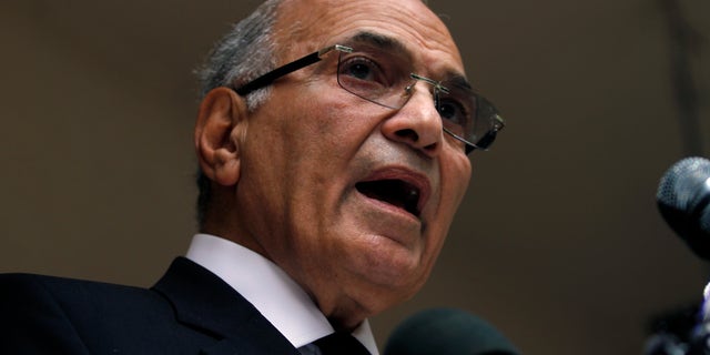 FILE - In this Saturday, May 26, 2012 file photo, Egyptian presidential candidate Ahmed Shafiq speaks to the media during a press conference at his office in Cairo, Egypt. Egyptian officials said Tuesday, Sept. 11, 2012 that Hosni Mubarak's last prime minister, Ahmed Shafiq, has been referred to trial on corruption charges in a case involving the ousted leader's sons. (AP Photo/Khalil Hamra, File)