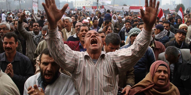 Dec. 30: Protesters chant slogans during a demonstration in Tahrir Square in Cairo, Egypt.