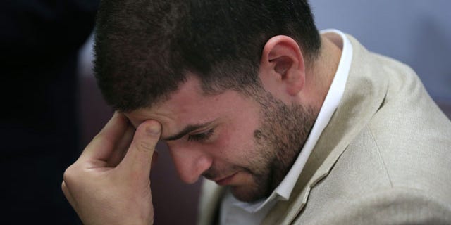 July 22, 2013: Osama Morsi, son of ousted Egyptian President Mohammed Morsi reacts during a press conference in Cairo