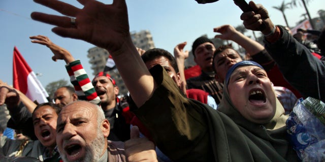 Nov. 30, 2012 - Egyptian protesters chant anti-Muslim Brotherhood slogans as they attend a rally in Tahrir Square, in Cairo, Egypt.