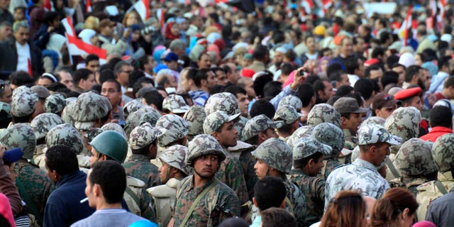 Feb. 12: Egyptian army soldiers surround an entrance to Tahrir Square, Egypt. The main coalition of youth and opposition groups says it will end its protest in a central Cairo square after they succeeded in ousting longtime authoritarian leader Hosni Mubarak. But the groups say they will call for weekly demonstrations to maintain pressure on the ruling military to implement democratic reforms. (AP)