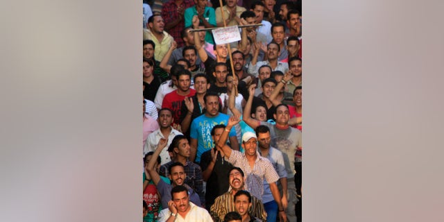 Angry Egyptian Christians protest against the military ruling council in Cairo Egypt, Monday, Oct. 10, 2011 a day after at least 24 people were killed when Christians, angered by a recent church attack, clashed Sunday night with Muslims and security forces outside the state television building in central Cairo.