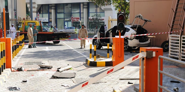 Jan. 26, 2015 - The scene after a car plunged 6 stories from a parking lot in Abu Dhabi, United Arab Emirates. State media says a 54 yo woman from Europe died after her car plunged from the parking lot in the capital.
