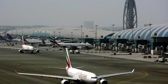 FILE - In Tuesday April 20, 2010 file photo, an Emirates airline passenger jet taxis on the tarmac at Dubai International airport in Dubai, United Arab Emirates. Officials say the Mideast’s busiest airport in Dubai will undergo a major runway overhaul starting next month that will see more than a dozen airlines shift flights to another airport in the city. (AP Photo/Kamran Jebreili, File)