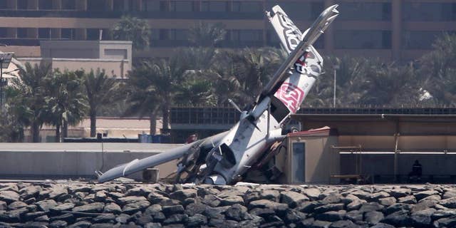 An aircraft belonging to a Dubai skydiving company is seen after crashing off the runway Friday, Oct. 2, 2015, in Dubai, United Arab Emirates. (AP Photo/Kamran Jebreili)