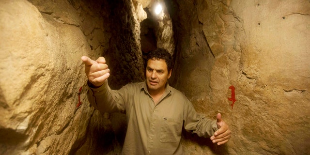 May 1, 2014: Eli Shukron, an archeologist formerly with Israel's Antiquities Authority, walks in the City of David archaeological site near Jerusalem's Old City. The dig, which began in 1995, uncovered a massive fortification and pottery shards that date to 3,800 years ago. Shukron says this is the legendary citadel captured by King David in his conquest of Jerusalem. But archaeologists are divided on identifying Davidic sites in Jerusalem, the city he is said to have made his capital. (AP Photo/Sebastian Scheiner)
