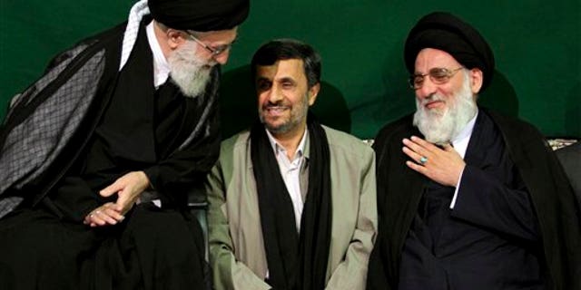 May 7, 2011: Iranian supreme leader Ayatollah Ali Khamenei, left, greets former Judiciary chief Ayatollah Mahmoud Hashemi Shahroudi, right, as President Mahmoud Ahmadinejad sits at center, during a religious ceremony, in Tehran, Iran.