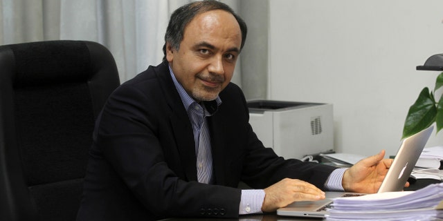 April, 12, 2014: In this undated photo provided by the office of the Iranian President, Hamid Aboutalebi, an Iranian diplomat, who was recently named as Iran's ambassador at the United Nations, sits in his office in Tehran, Iran.