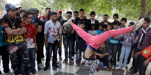 Nov. 10, 2011: An Iraqi boy dances to hip hop music in Baghdad, Iraq. After more than eight years in Iraq, the departing American military's legacy includes a fledgling democracy, bitter memories of war, and for the nation's youth, rap music, tattoos and slang.