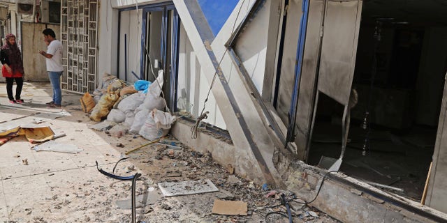 June 5, 2014 - Iraqi civilians inspect the damages in the aftermath of a bomb in a commercial street in Baghdad. Iraq is experiencing its worst surge in violence since the sectarian bloodletting that nearly tore the country apart in 2006 and 2007.